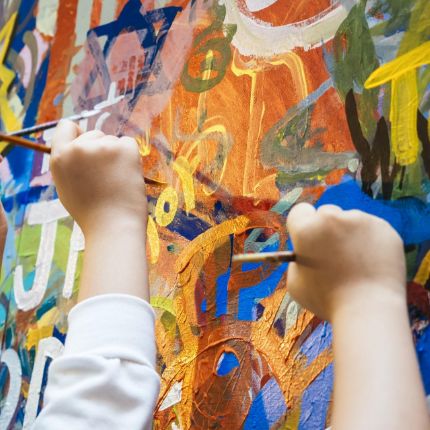 students painting a mural
